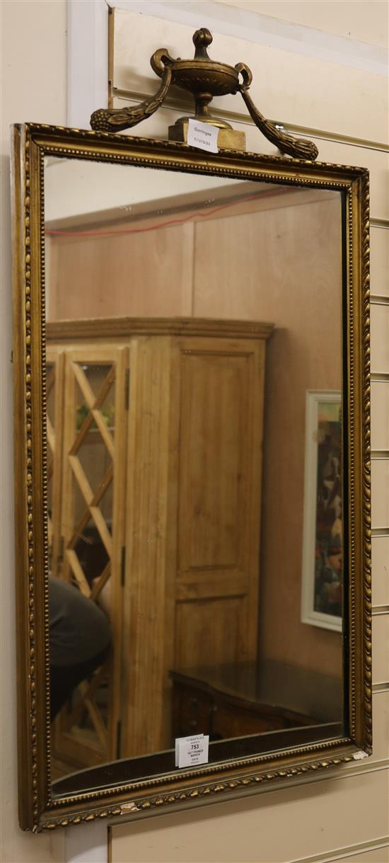 A giltwood and gesso wall wall mirror, with an urn pediment W.48cm